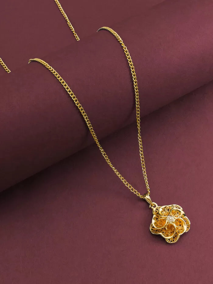 Warm gold pendant with a blooming floral design that has a subtle 'glow'.