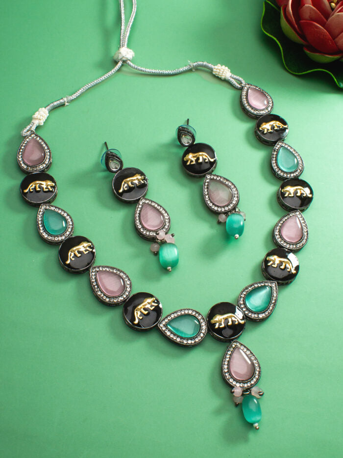 Regal kundan jewelry set with an oxidised finish and a panther-inspired design.