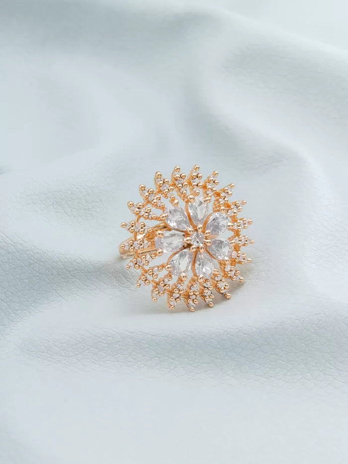 Statement ring with a sparkling white floral design set with 'AD' (American Diamonds).