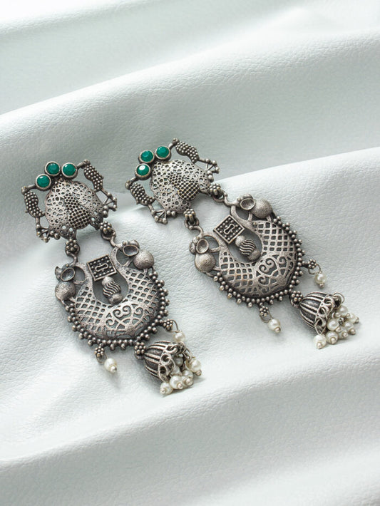 Vintage-style ethnic jewelry set in oxidised silver with green bead accents and jhumki earrings.