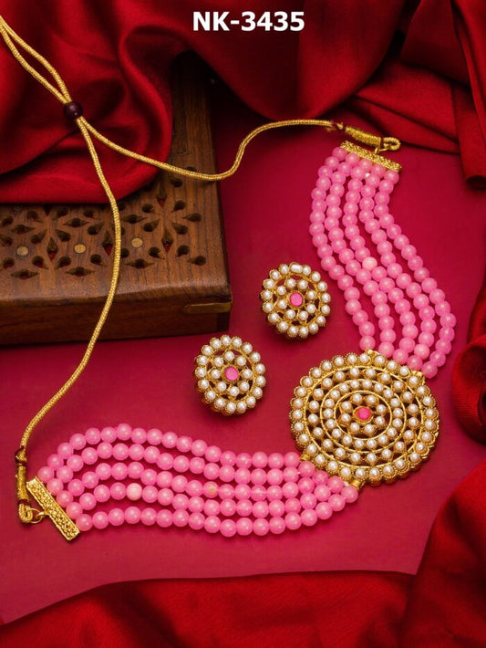 Delicate choker necklace and earrings set with baby pink beads and kundan work.