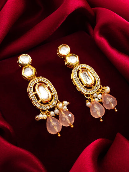 Designer earrings with a soft blush color, gold plating, and a radiant shine.