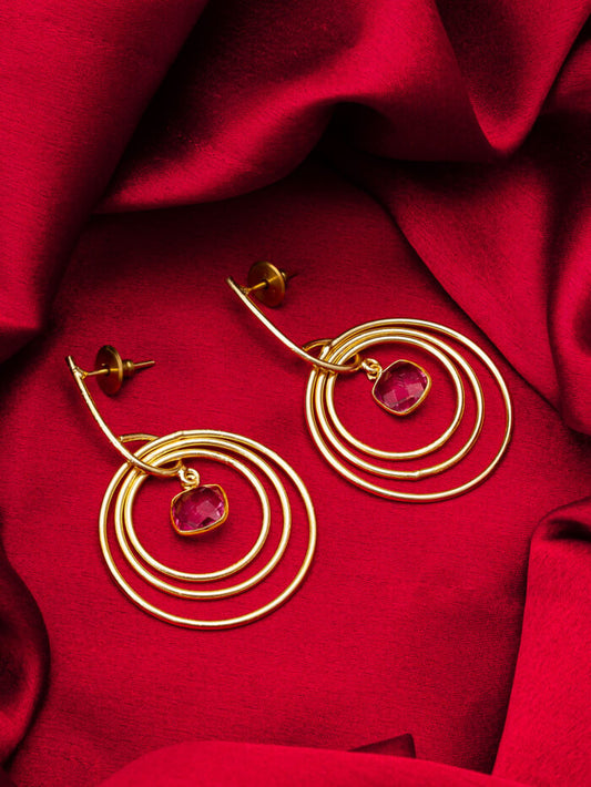 Drop earrings with a celestial 'orbit' design featuring triple hoops.