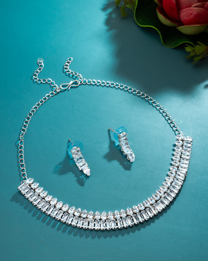 Charming necklace set adorned with crystals and American Diamonds.