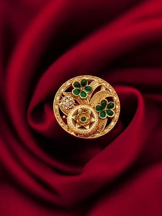 Stunning ring with an 'emerald garden' design featuring green gemstones and floral elements.