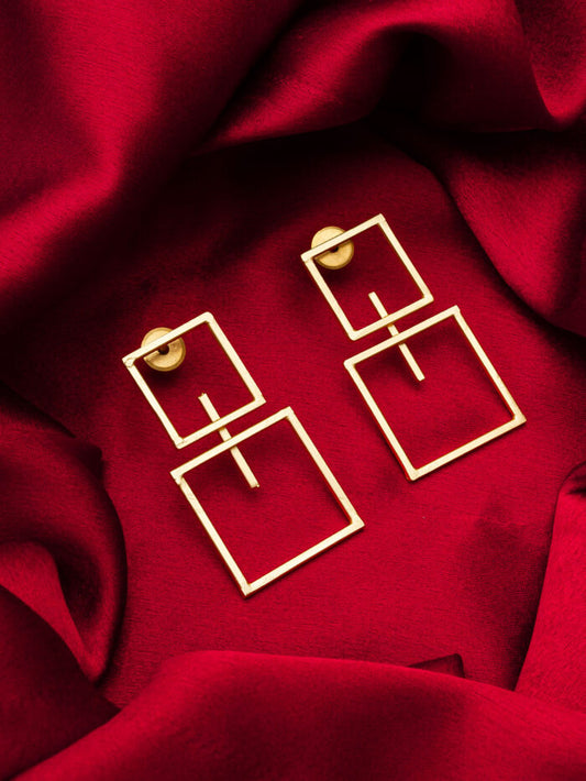 Drop earrings with a geometric double square design, inspiring a 'muse'.