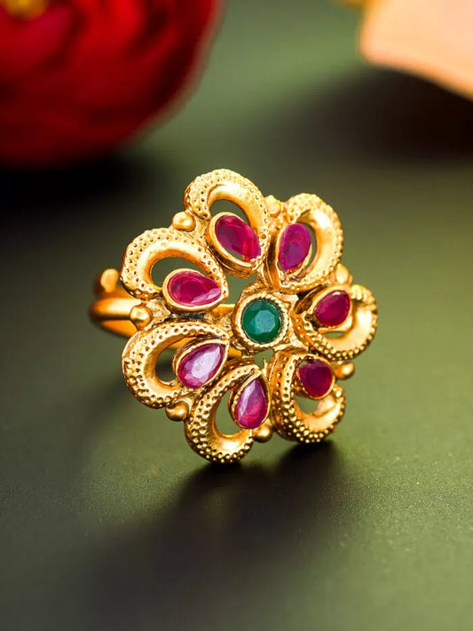 Vintage heritage-style cocktail ring with a floral bloom design and gemstone center.