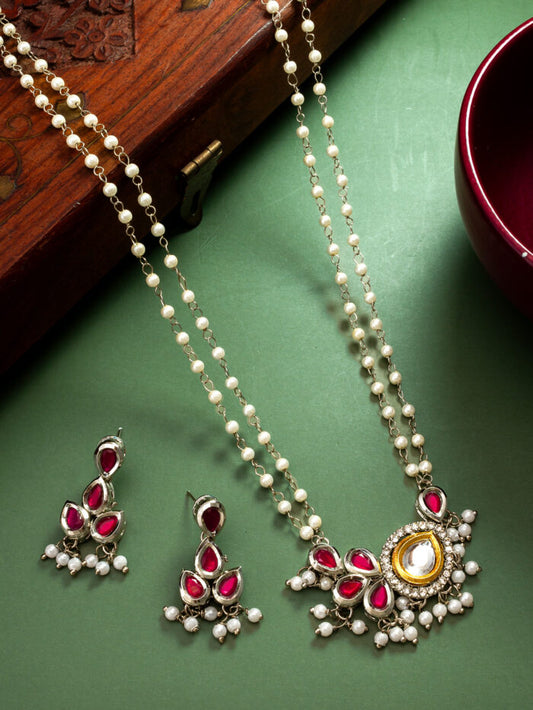 Festive multicolor necklace set featuring kundan work and pearl accents.