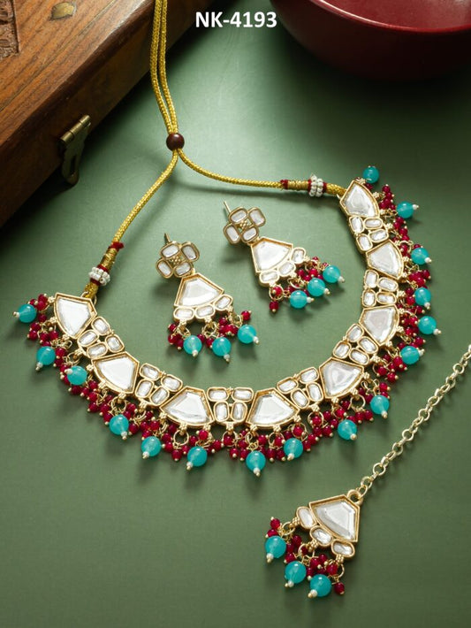 Elegant necklace set with colorful kundan work in a drop design.
