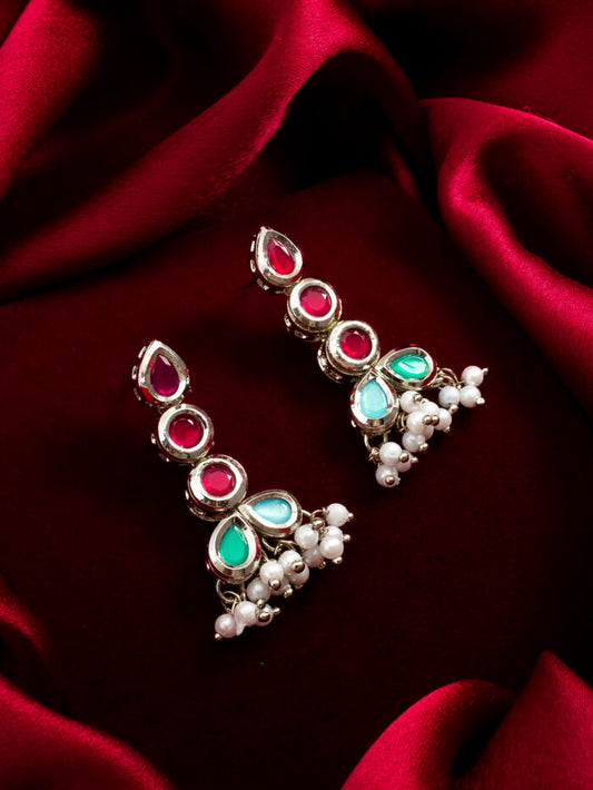 Regal drop earrings with colorful kundan work and pearl accents, exuding a radiant look.