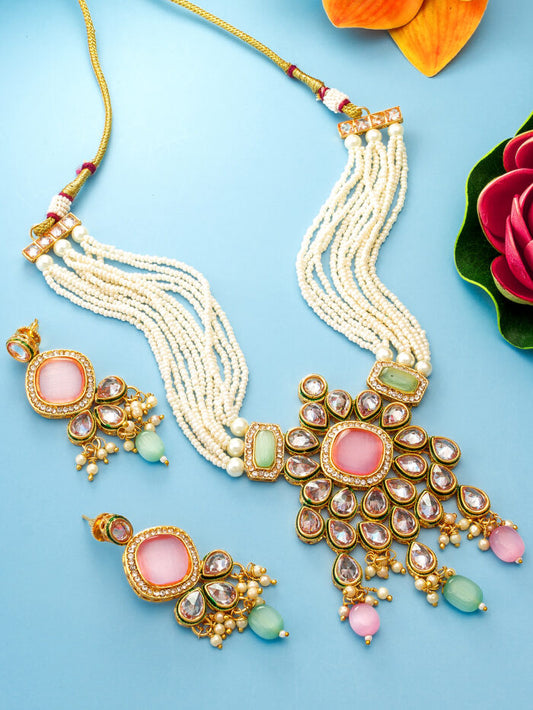 Festive jewelry set featuring colorful kundan work and pearl accents.