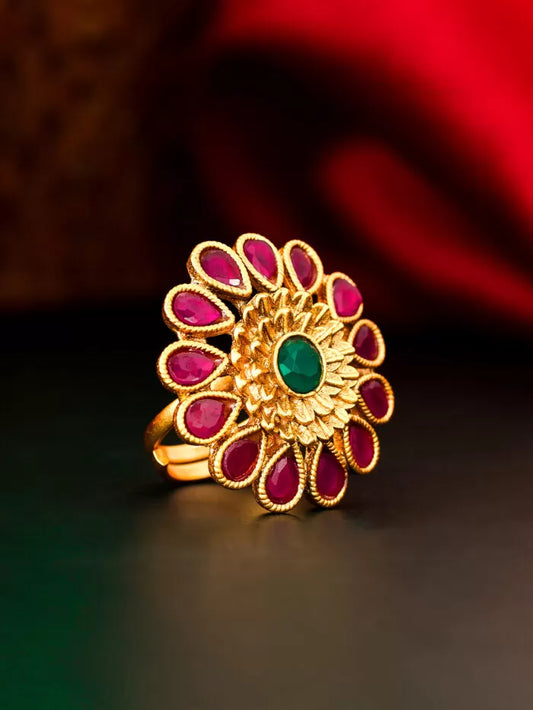 Bold statement ring with a royal-inspired blossom design and gemstone accents.