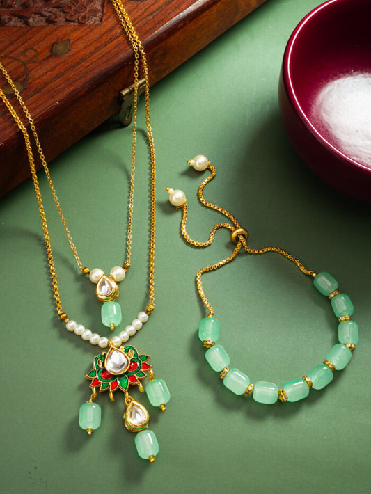 Regal necklace and bracelet set with meenakari enamel work and mint-colored kundan stones.