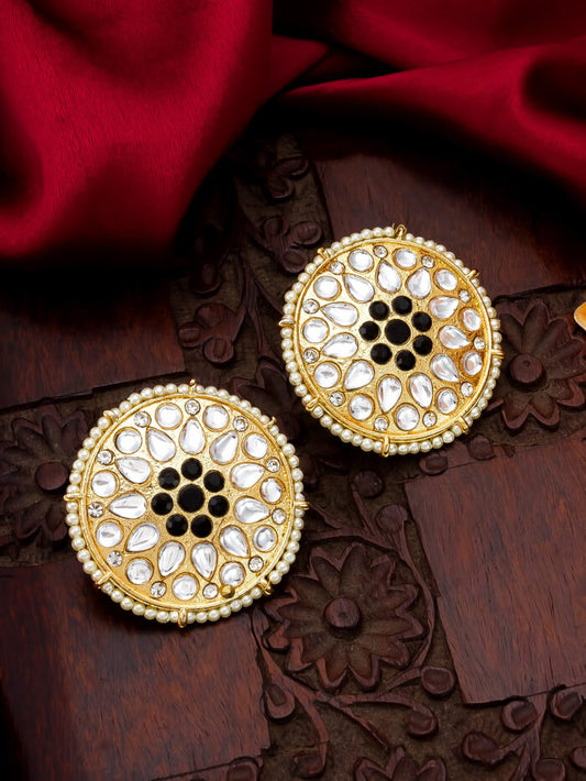 Regal black ('noir') stud earrings with intricate kundan work.
