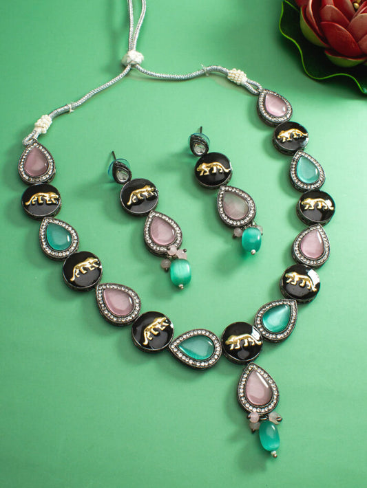 Regal kundan jewelry set with an oxidised finish and a panther-inspired design.