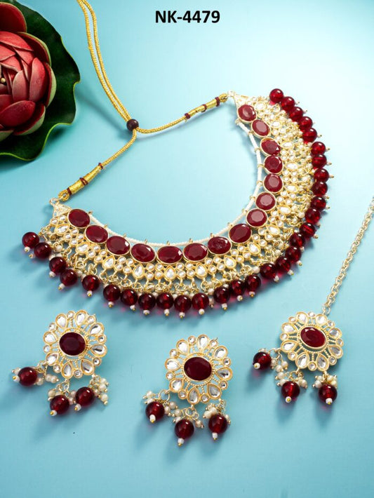 Regal jewelry set with ruby red meenakari enamel work.
