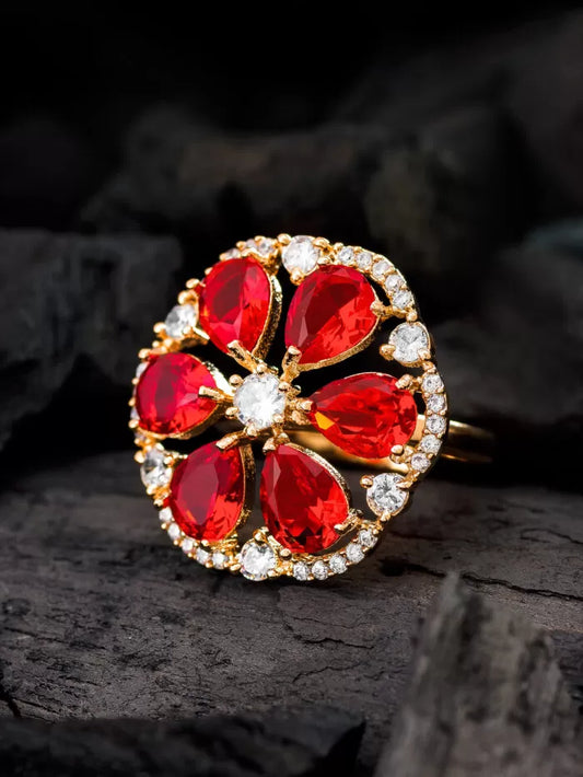 Beautiful ring with a petal-like design in a vibrant ruby red color with a radiant shine.