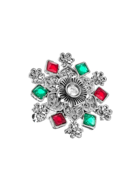 Delicate silver ring with small, star-like charm details.